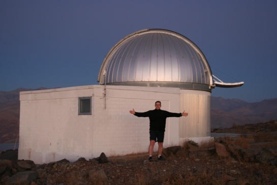 Michaël Gillon posing in front of TRAPPIST, a Belgian robotic telescope installed by himself and his Liege colleagues in 2010 in the Chilean Atacama Desert. TRAPPIST is dedicated to the study of planetary systems. For more information, see http://www.ati.ulg.ac.be/TRAPPIST